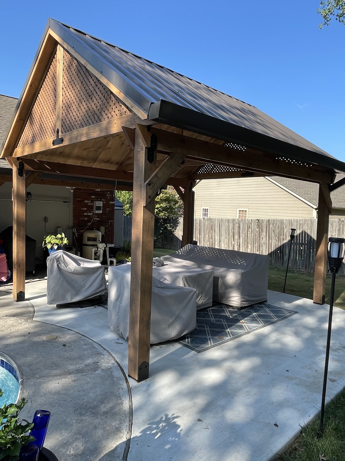 Wooden pergola over a concrete patio