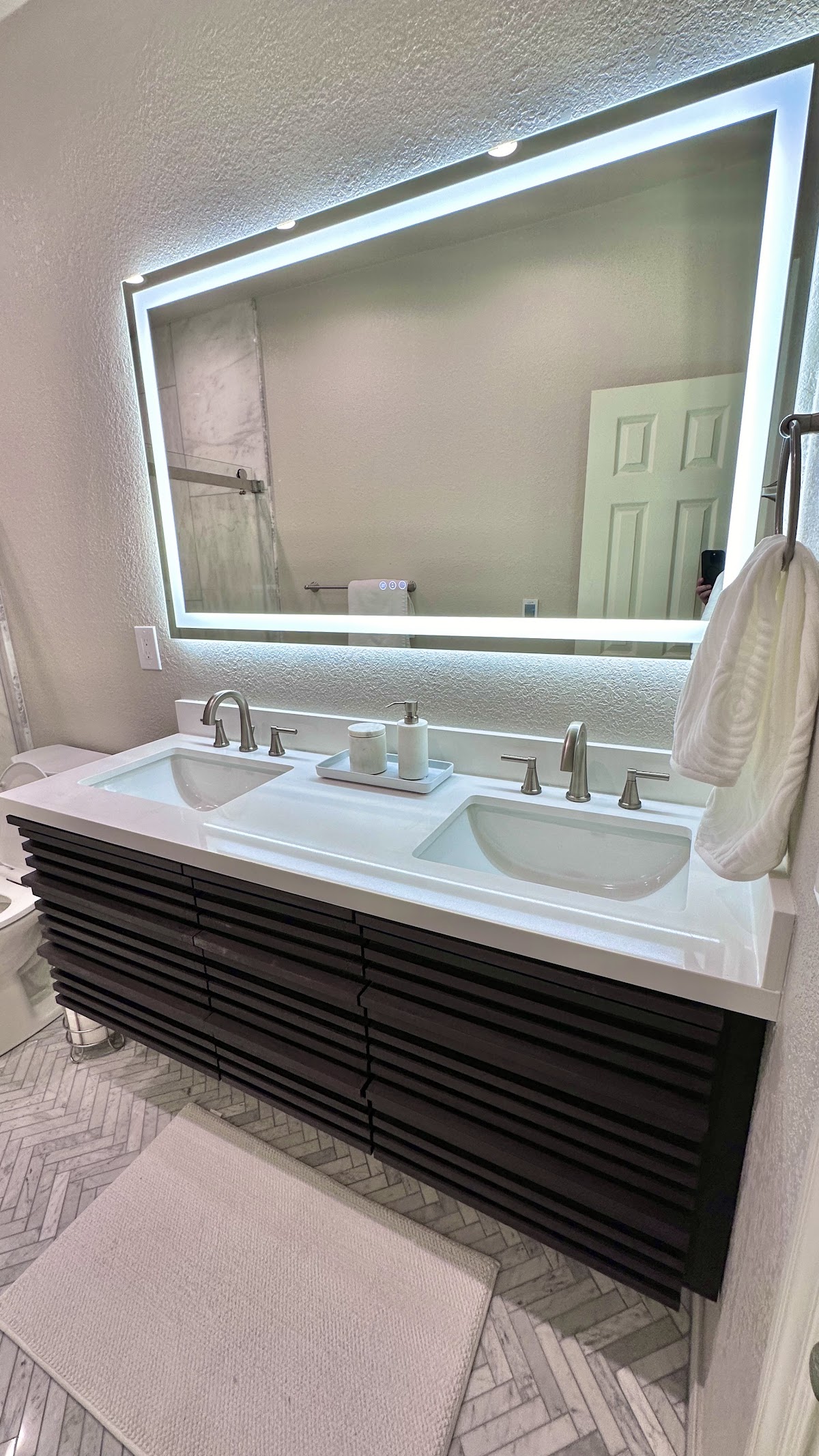 Double vanity with a backlit LED mirror