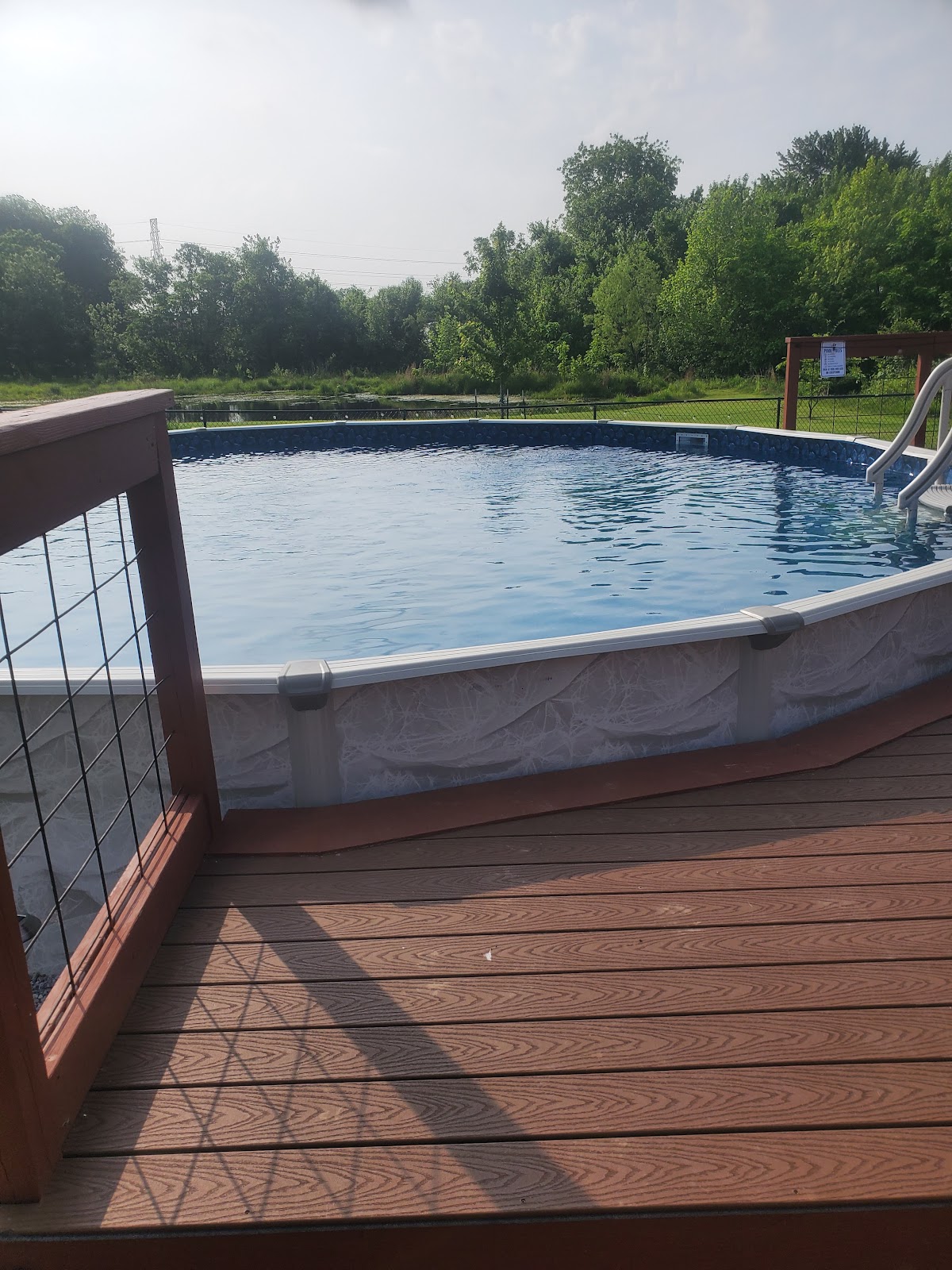 Composite deck built around an above ground pool