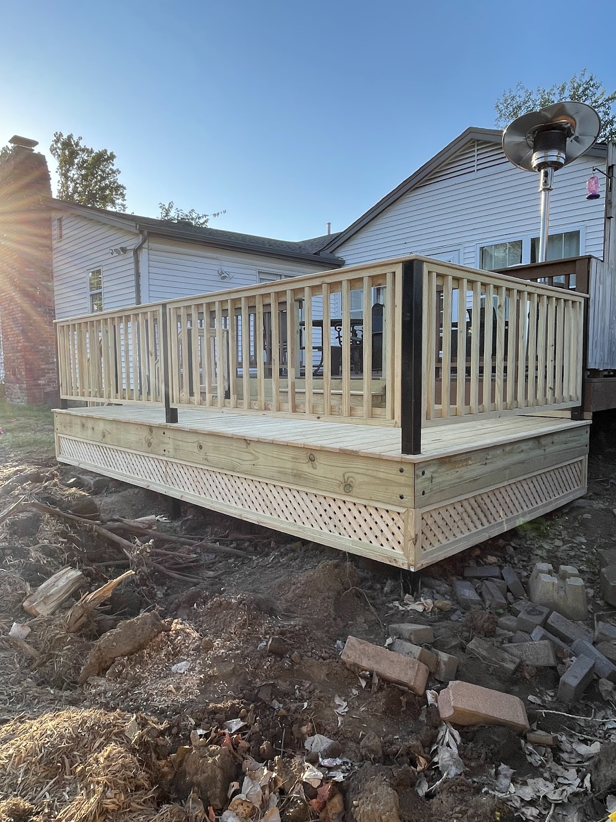 New raised deck with railing and lattice skirt
